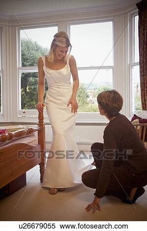 A bride having her dress fitted View Large Photo Image Stock Photography - A bride having her dress fitted. Fotosearch