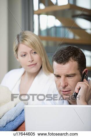 A couple working at home View Large Photo Image Stock Photography - A couple working at home. Fotosearch