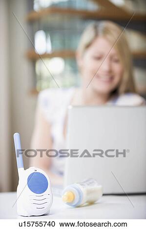 A mother working from home View Large Photo Image Stock Image - A mother working from home. Fotosearch