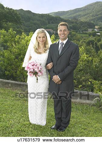 Bride and groom in garden View Large Photo Image Stock Photo - Bride and groom in garden. Fotosearch