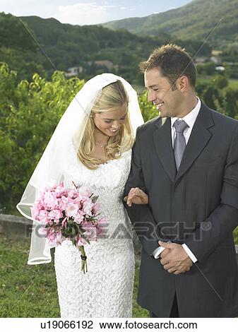 Bride looking at wedding ring View Large Photo Image Stock Image - Bride looking at wedding ring. Fotosearch