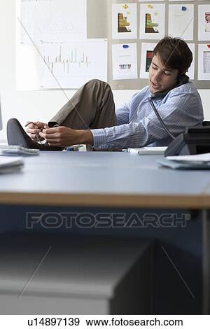Stock Photo - Businessman using telephone. Fotosearch