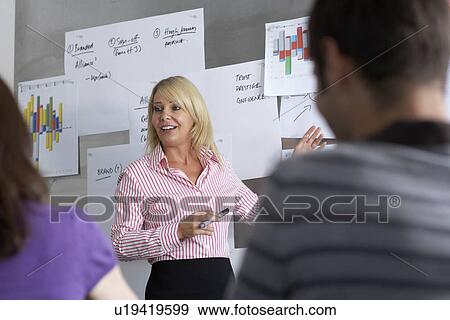 Businesswoman giving presentation View Large Photo Image Stock Photo - Businesswoman giving presentation. Fotosearch