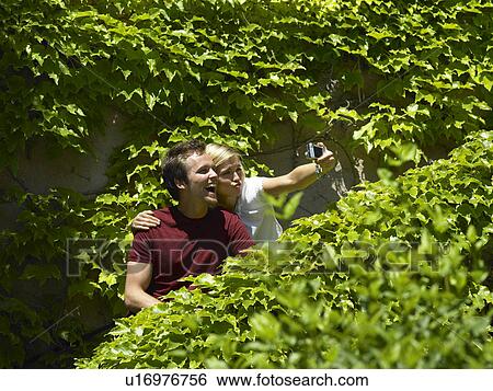Couple taking picture on steps View Large Photo Image Stock Photograph - Couple taking picture on steps. Fotosearch