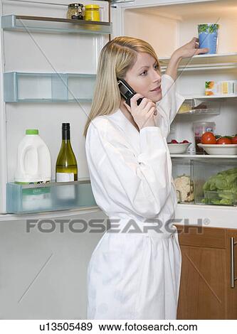 Female on the phone in the morning View Large Photo Image Stock Photo - Female on the phone in the morning. Fotosearch