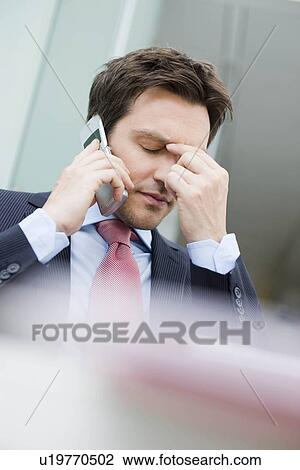 Man on cell phone gesturing concern View Large Photo Image Stock Image - Man on cell phone gesturing concern. Fotosearch