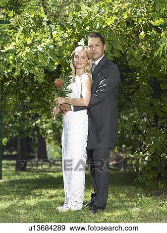 Portrait of bride and groom in garden View Large Photo Image Stock Photo - Portrait of bride and groom in garden. Fotosearch