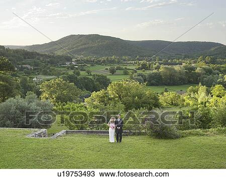 Wedding couple in garden View Large Photo Image Stock Image - Wedding couple in garden. Fotosearch