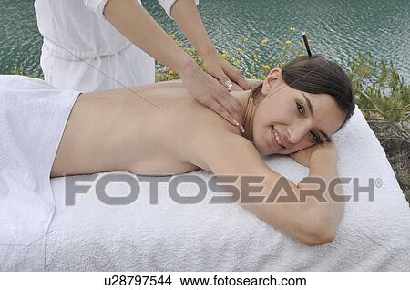 Woman having a massage View Large Photo Image Picture - Woman having a massage . Fotosearch