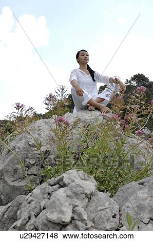 Woman meditating View Large Photo Image Stock Photo - Woman meditating . Fotosearch