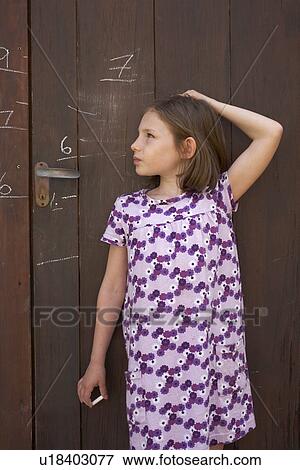 Young girl measuring herself View Large Photo Image Stock Photo - Young girl measuring herself. Fotosearch