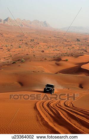 Stock Image - dubai, desert, jeep, wrangler, ride, safari, dune. Fotosearch