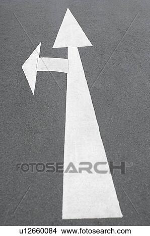 Picture - Arrow sign painted on the road. Fotosearch