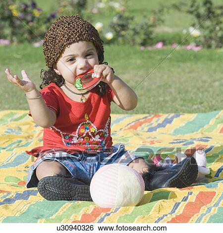 Baby girl biting a teething ring View Large Photo Image Stock Photograph - Baby girl biting a teething ring. Fotosearch