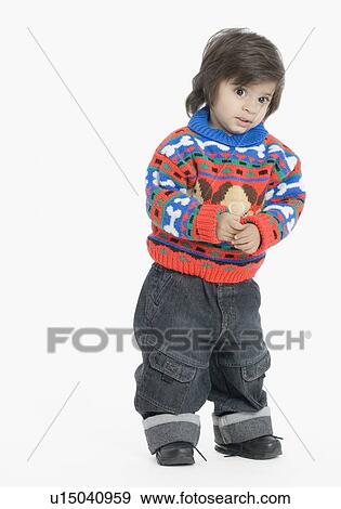 Boy standing and looking away View Large Photo Image Stock Photo - Boy standing and looking away. Fotosearch