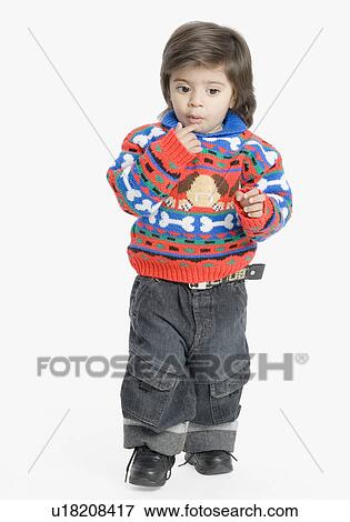 Stock Photo - Boy thinking with his hand on his chin. Fotosearch