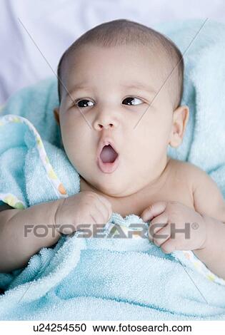 Close-up of a baby girl yawning View Large Photo Image Stock Image - Close-up of a baby girl yawning. Fotosearch