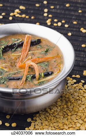 Stock Photograph - Close-up of a bowl of black lentil curry . Fotosearch