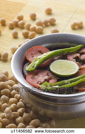 Stock Image - Close-up of a bowl of chick pea curry. Fotosearch