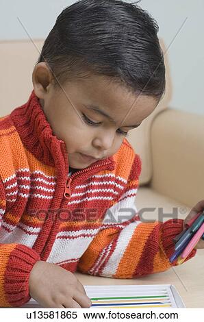 Close-up of a boy choosing a crayon View Large Photo Image Stock Photography - Close-up of a boy choosing a crayon. Fotosearch