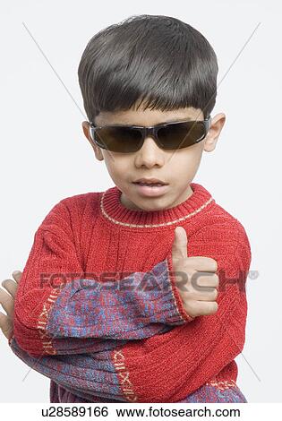 Stock Photograph - Close-up of a boy making a thumbs up sign. Fotosearch