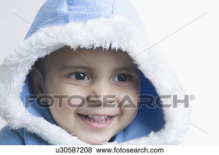Close-up of a boy smiling View Large Photo Image Stock Photo - Close-up of a boy smiling. Fotosearch