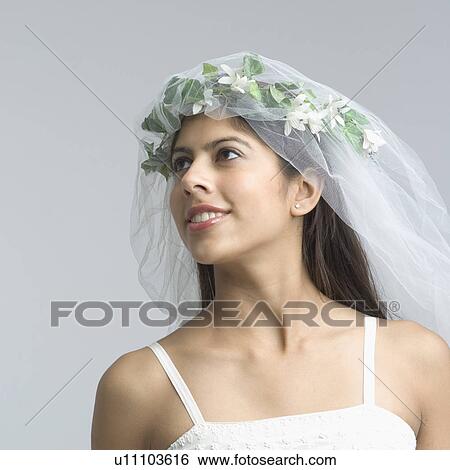 Close-up of a bride smiling View Large Photo Image Stock Photograph - Close-up of a bride smiling. Fotosearch