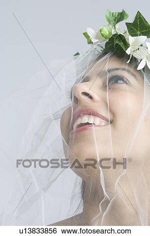 Stock Photograph - Close-up of a bride smiling. Fotosearch