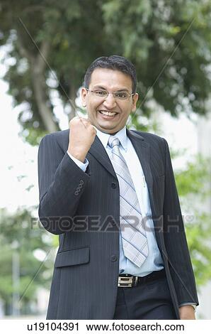 Close-up of a businessman making a fist View Large Photo Image Stock Image - Close-up of a businessman making a fist. Fotosearch