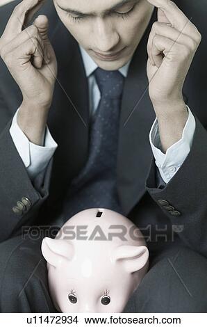 Close-up of a businessman with his fingers on his temples View Large Photo Image Picture - Close-up of a businessman with his fingers on his temples. Fotosearch