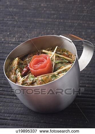 Stock Photo - Close-up of a dish of cottage cheese served in a mug. Fotosearch