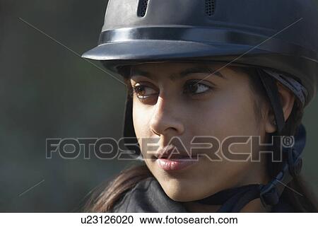 Stock Image - Close-up of a female jockey. Fotosearch