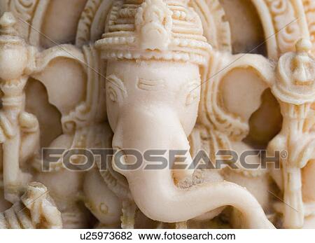 Close-up of a figurine of Lord Ganesha View Large Photo Image Stock Image - Close-up of a figurine of Lord Ganesha. Fotosearch