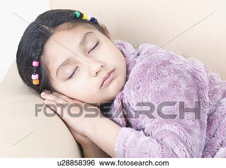 Close-up of a girl sleeping View Large Photo Image Stock Photograph - Close-up of a girl sleeping. Fotosearch