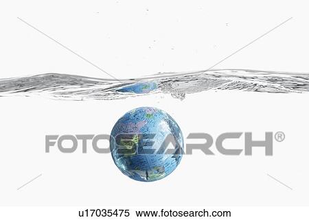 Stock Photography - Close-up of a globe underwater. Fotosearch