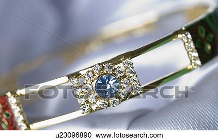 Stock Image - Close-up of a gold bracelet. Fotosearch