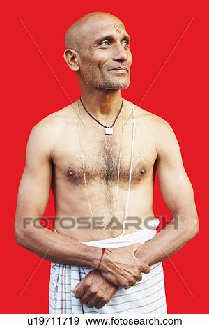 Stock Photo - Close-up of a mature man smirking. Fotosearch
