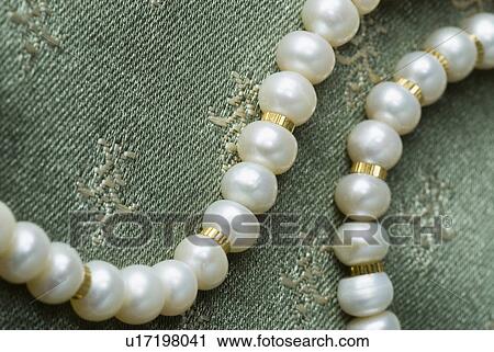 Stock Image - Close-up of a pearl necklace. Fotosearch