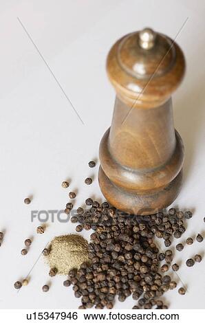 Close-up of a peppermill and peppercorns View Large Photo Image Stock Photograph - Close-up of a peppermill and peppercorns. Fotosearch