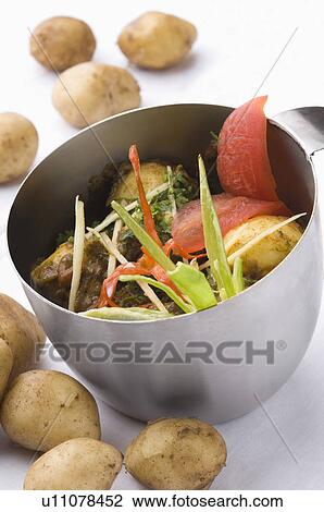 Close-up of a potato dish served in a bowl View Large Photo Image Stock Image - Close-up of a potato dish served in a bowl. Fotosearch