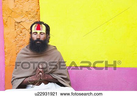 Stock Image - Close-up of a sadhu praying. Fotosearch