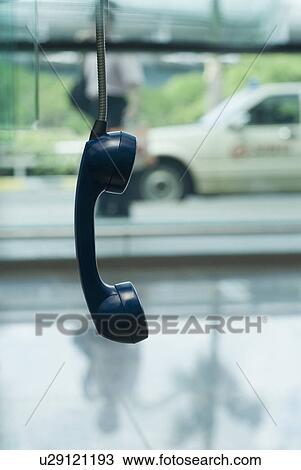 Close-up of a telephone receiver hanging View Large Photo Image Stock Image - Close-up of a telephone receiver hanging. Fotosearch