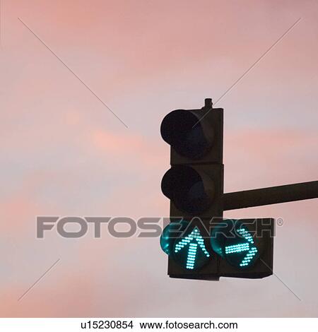 Close-up of a traffic light displaying green arrows View Large Photo Image Picture - Close-up of a traffic light displaying green arrows. Fotosearch