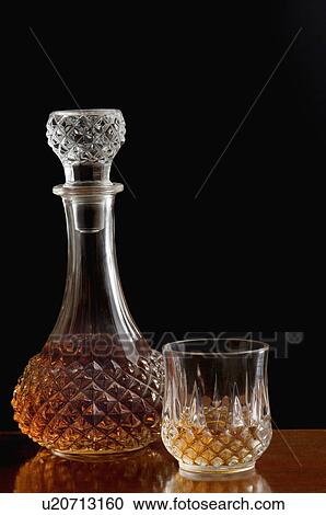 Close-up of a wine bottle and a glass of wine View Large Photo Image Stock Image - Close-up of a wine bottle and a glass of wine. Fotosearch