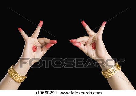 Stock Image - Close-up of a woman's hand making a Bharatnatyam gesture. Fotosearch