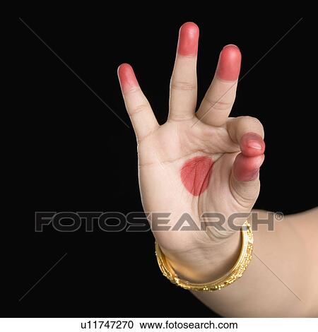Stock Image - Close-up of a woman's hand making a Bharatnatyam gesture. Fotosearch