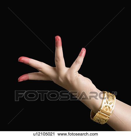 Stock Image - Close-up of a woman's hand making a Bharatnatyam gesture. Fotosearch