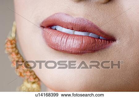 Close-up of a woman's lips View Large Photo Image Stock Photo - Close-up of a woman's lips. Fotosearch