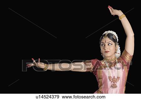 Close-up of a young woman performing Bharatnatyam View Large Photo Image Stock Photo - Close-up of a young woman performing Bharatnatyam. Fotosearch