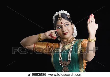 Close-up of a young woman performing Bharatnatyam View Large Photo Image Stock Photograph - Close-up of a young woman performing Bharatnatyam. Fotosearch